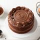 Beating chocolate buttercream frosting with electric mixer until light and fluffy"