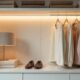 Motion sensor LED strip light mounted on white closet shelf showing flexible design and warm lighting
