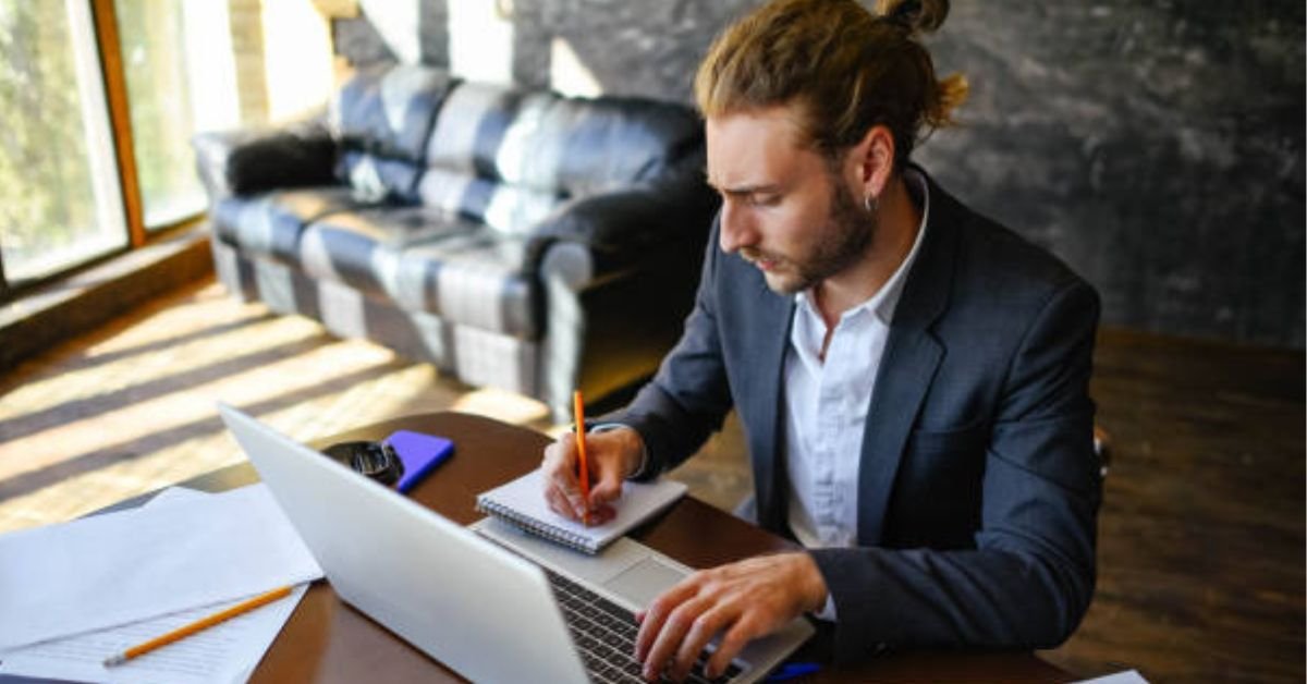 Alt text: "Copywriting workspace with laptop and notebook for beginners learning to write persuasive copy"